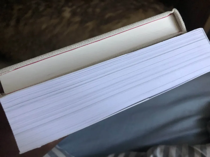 two books stacked on each other. One is thicker than the other.